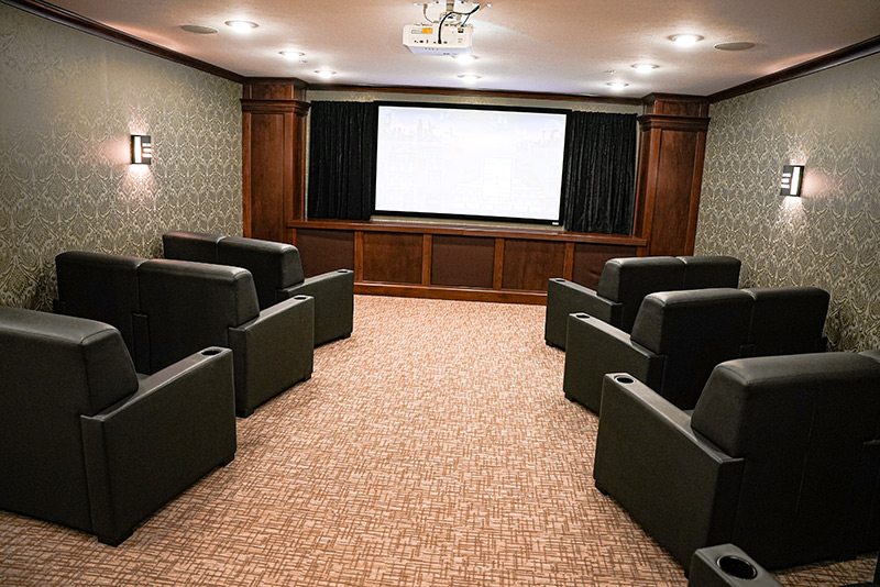 Movie theater room with comfortable leather chairs at Traditions of Westfield